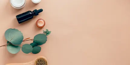 Skincare products arranged on a peach background